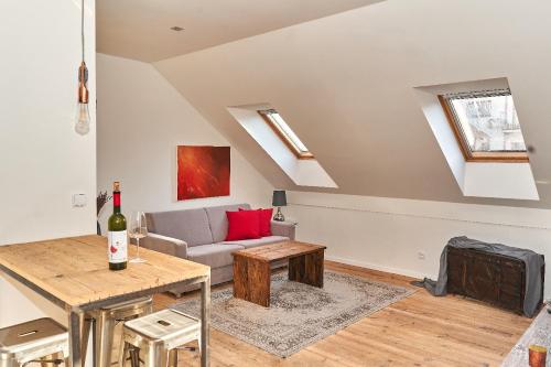 a living room with a couch and a table at Apartmán NEWSTALGIE in Mikulov