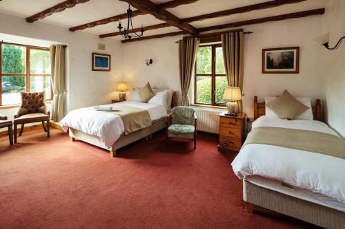Postel nebo postele na pokoji v ubytování Tudor Lodge B&B