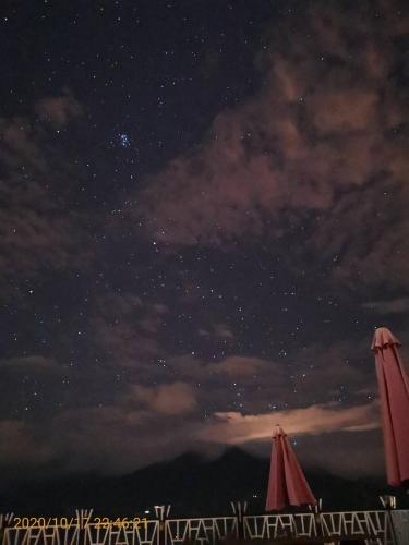 a starry night with two umbrellas on a beach at Naluwan Villa in Renai