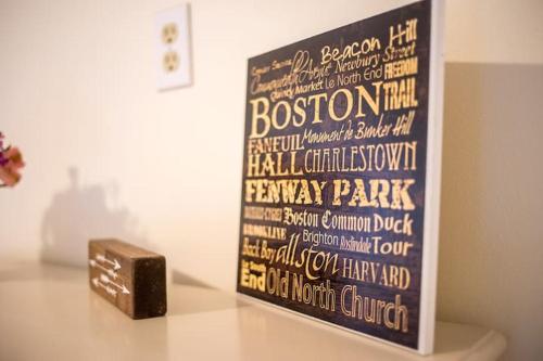 a sign on a table with a box on it at The Boston Rental - Multiple Floorplans in Boston