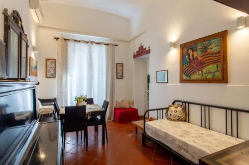 a living room with a couch and a dining room at Le Dimore del Mito - Atalanta in Siracusa