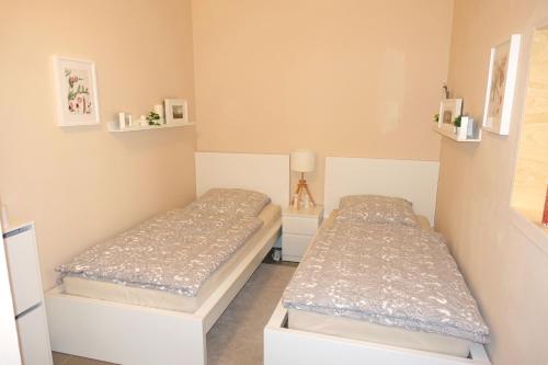 A bed or beds in a room at Sehr schöne Ferienwohnung im historischen Borken-Gemen