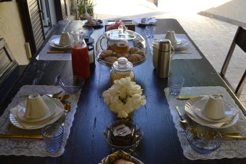 a blue table with food on top of it at Torre Di Sebastiano in Gaggi