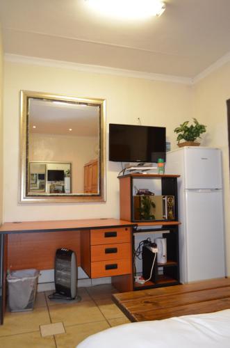 Η κουζίνα ή μικρή κουζίνα στο Zebra Guesthouse