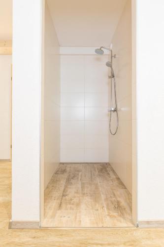 a shower with a glass door in a bathroom at Apart&Chalet Chiara in Neustift im Stubaital