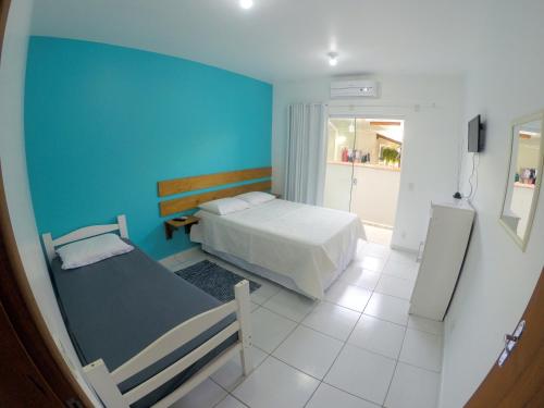Postel nebo postele na pokoji v ubytování Florianópolis Pousada Moçambeach
