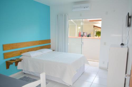 Cama ou camas em um quarto em Florianópolis Pousada Moçambeach