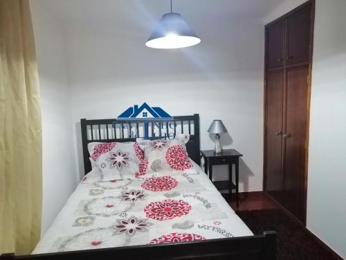 מיטה או מיטות בחדר ב-Cantinho do Ilho