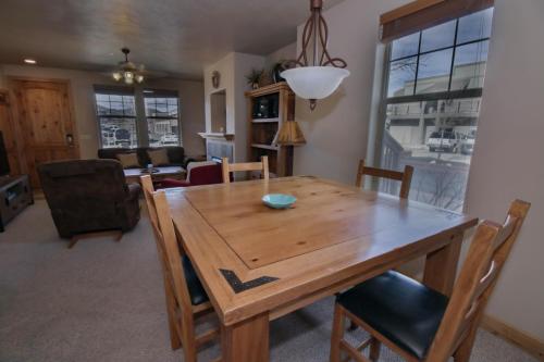 a dining room with a wooden table and chairs at Fox Pointe Condo by Park City Vacations in Park City