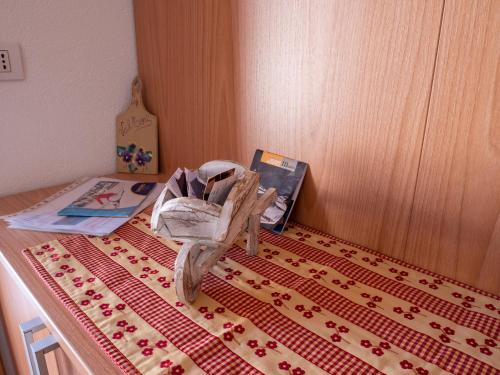 a table with a bag on top of a table at Bait Nof - Trepalle in Livigno