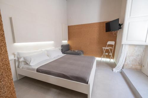 A bed or beds in a room at Casa Berenice