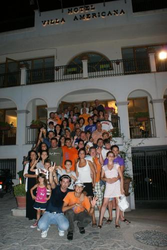 a group of people posing for a picture in front of a building at Park Hotel Villa Americana in Rodi Garganico