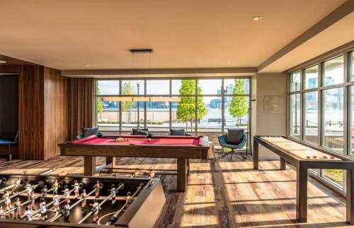 a billiard room with a pool table and a pool table at Global Luxury Suites East Boston in Boston