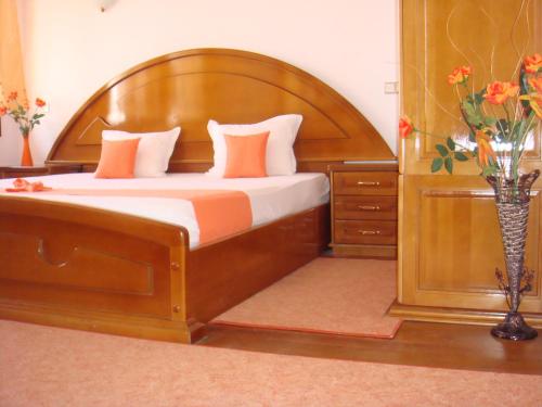 Family Hotel Elegance tesisinde bir odada yatak veya yataklar