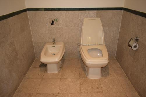 a bathroom with a toilet and a bidet at Grand Service Apartment @ Times Square in Kuala Lumpur