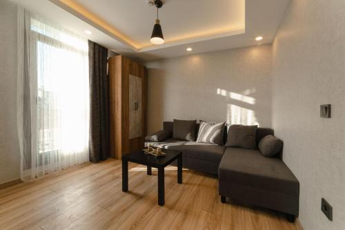 a living room with a couch and a table at World Heritage Center Hotel in Istanbul