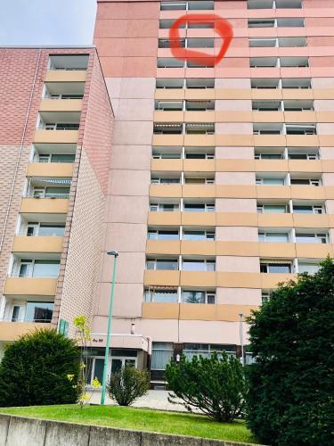 a large apartment building with a red sign on it at Ferienwohnung Rapunzel in Altenau