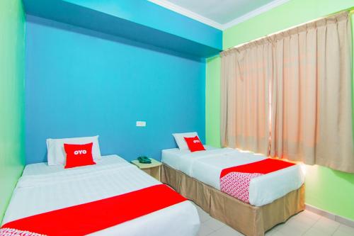 Katil atau katil-katil dalam bilik di Super OYO 1159 Hotel New Sabah