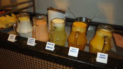 a display of different types of jars of juice at Ilhabela Park Hotel in Brasilia