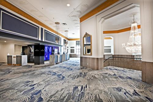 a lobby of a hotel with a marble floor and a chandelier at Crowne Plaza Hotel-Niagara Falls/Falls View, an IHG Hotel in Niagara Falls
