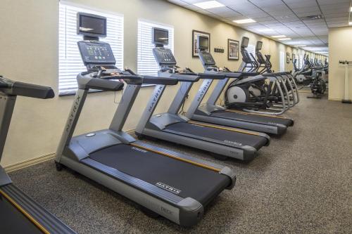 a row of tread machines in a gym at Crowne Plaza Hotel and Suites Pittsburgh South by IHG in Pittsburgh