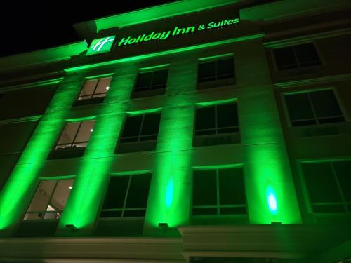 a building with green lights on it at night at Holiday Inn & Suites - Hopkinsville - Convention Ctr by IHG in Hopkinsville