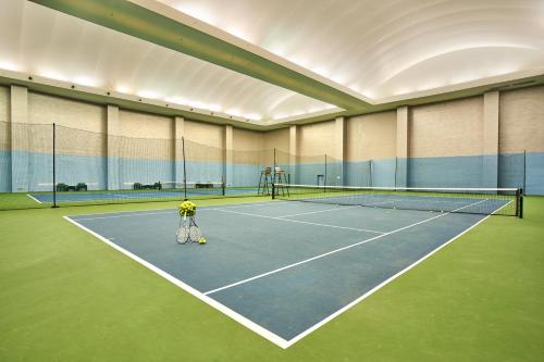 a tennis court with a person standing on it at Crowne Plaza Tianjin Binhai by IHG in Tianjin