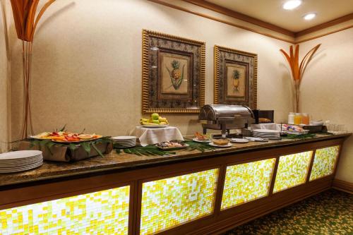 a buffet in a hotel room with food on it at Crowne Plaza Torreon by IHG in Torreón