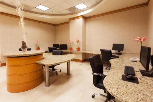 an office with tables and chairs in a room at Crowne Plaza Torreon by IHG in Torreón