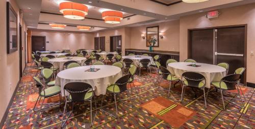 a conference room with tables and chairs in it at Staybridge Suites DFW Airport North by IHG in Irving