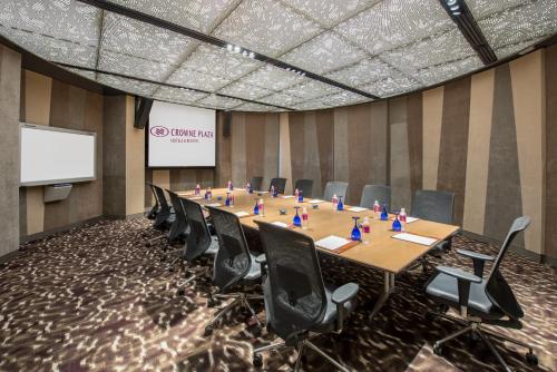 a conference room with a long table and chairs at Crowne Plaza Changi Airport by IHG in Singapore