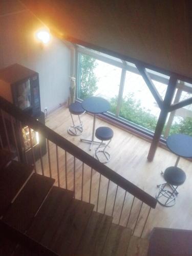 an overhead view of a room with tables and chairs at Hotel Restaurant De La Poste Mulhouse Ottmarsheim in Bantzenheim