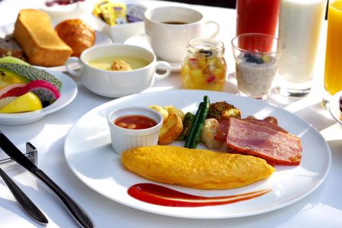 a white plate of breakfast food on a table at ANA Crowne Plaza Fukuoka by IHG in Fukuoka