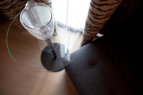 a wine glass sitting on top of a table at Crowne Plaza Verona Fiera by IHG in Verona