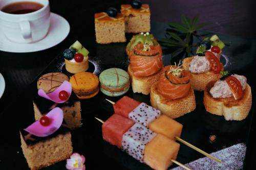 a plate of food with different types of food at Howard Johnson Neodalle Resort Zhangjiajie in Zhangjiajie
