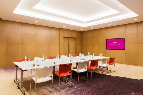 a large conference room with a long table and chairs at Crowne Plaza Vientiane by IHG in Vientiane