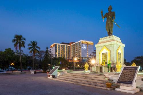 a statue of a man sitting on top of a monument at Crowne Plaza Vientiane by IHG in Vientiane