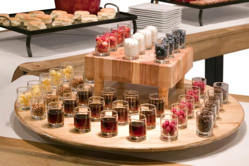 a tray of glasses of alcohol on a table at Crowne Plaza Phoenix Airport - PHX by IHG in Phoenix