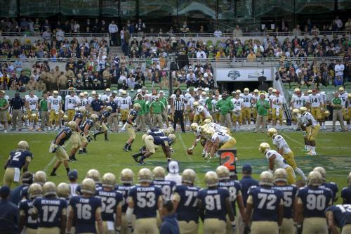 a group of football players on a field with a crowd at Crowne Plaza Annapolis by IHG in Annapolis
