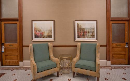 two chairs and a table in a room at Staybridge Suites Baltimore - Inner Harbor by IHG in Baltimore