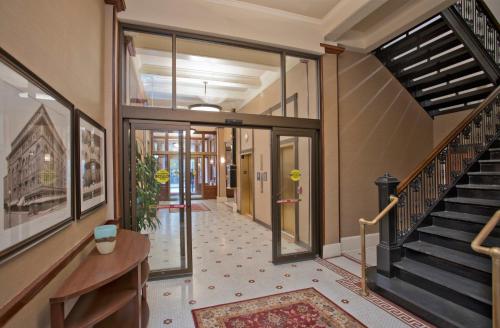 a hallway with a staircase in a building at Staybridge Suites Baltimore - Inner Harbor by IHG in Baltimore