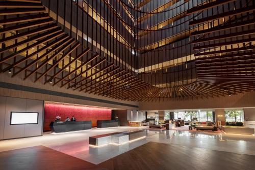 a lobby of a building with a large ceiling at Crowne Plaza Tainan by IHG in Tainan