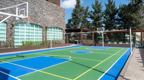 an indoor basketball court in front of a building at Staybridge Suites Puebla by IHG in Puebla