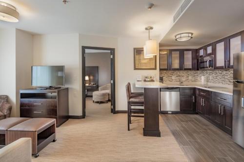 a kitchen with a living room and a dining room at Staybridge Suites Silao by IHG in Silao