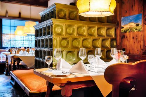 a dining room with a table with wine glasses at Crowne Plaza Frankfurt Congress Hotel by IHG in Frankfurt/Main