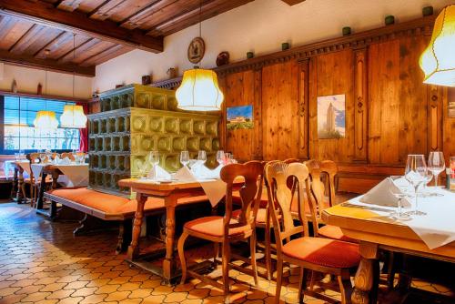 a restaurant with wooden walls and tables and chairs at Crowne Plaza Frankfurt Congress Hotel by IHG in Frankfurt/Main