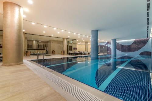 a large swimming pool in a building at Crowne Plaza Cappadocia - Nevsehir, an IHG Hotel in Nevsehir