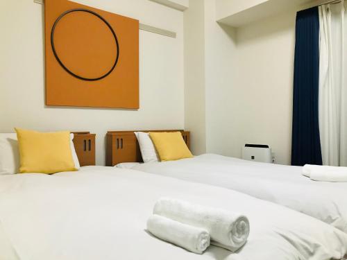 Lova arba lovos apgyvendinimo įstaigoje Ostay Kitahama Hotel Apartment