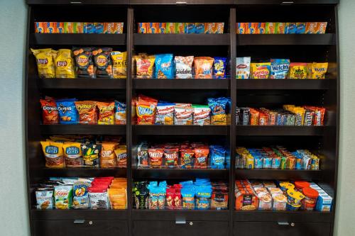 a refrigerator filled with lots of bags of chips at Staybridge Suites - Washington DC East - Largo by IHG in Largo