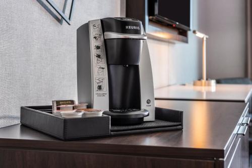 a coffee maker on a counter in a kitchen at Staybridge Suites - Boston Logan Airport - Revere by IHG in Revere